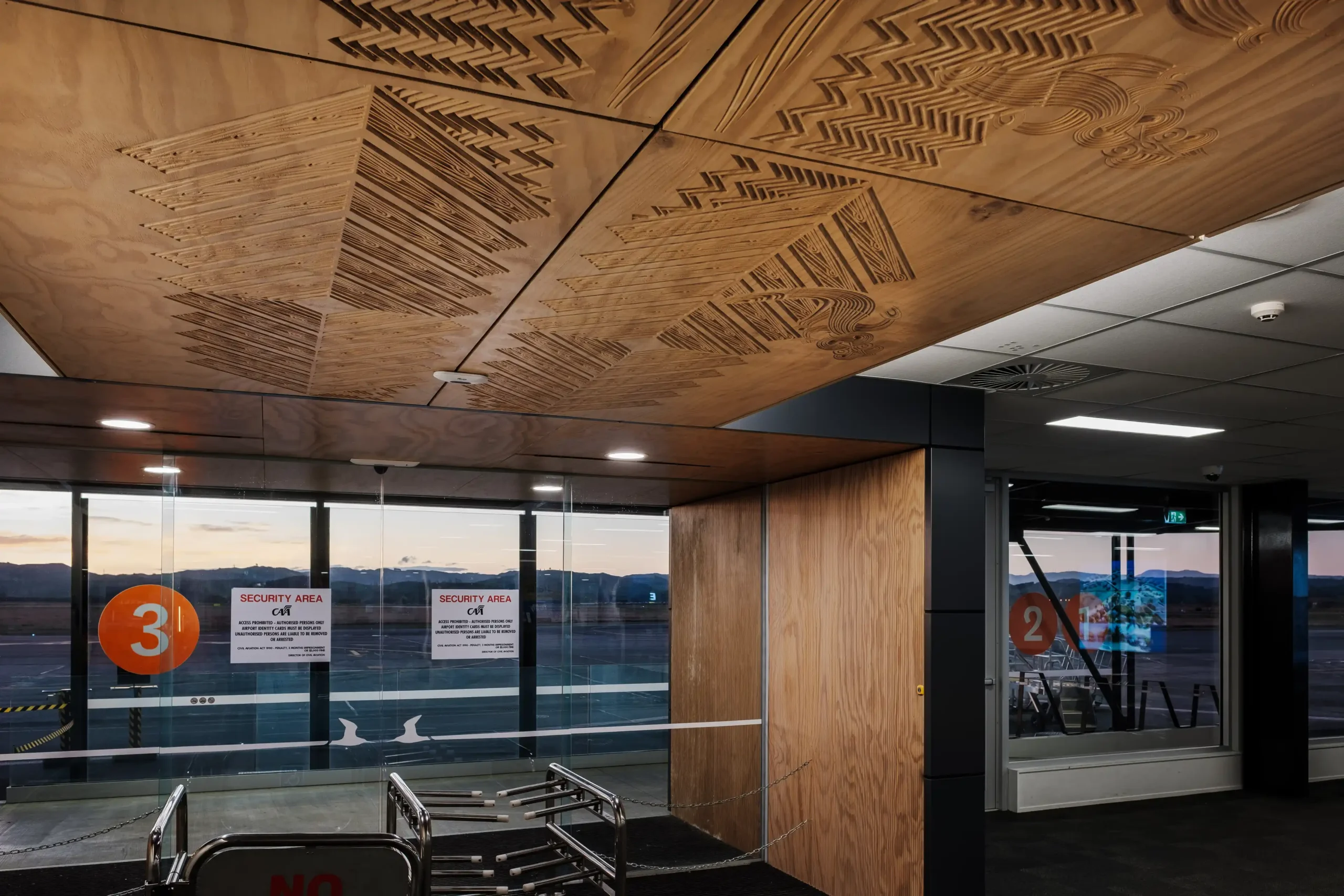 Hawkes Bay Airport - gate with whakairo on ceiling panels